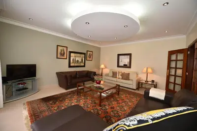 a living room with a couch and a table at Villa Santana in Funchal