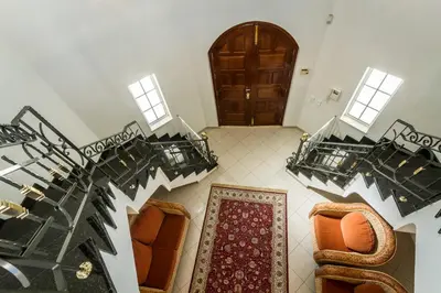 an overhead view of a living room with a spiral staircase at Casa Clementina in Lagos