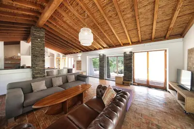 a living room with a couch and a table at Monte Da Vilarinha in Carrapateira