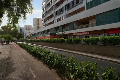 a street with plants on the side of a building at The Lidosol - Phenomenal view over the Atlantic Ocean in Funchal