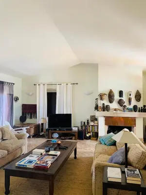 a living room with a couch and a coffee table at Dona Maria 66 in Luz