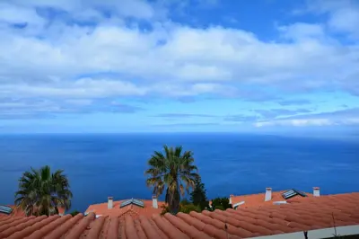 a view of the ocean from the roof of a house at Hotel Jardim Atlantico in Calheta