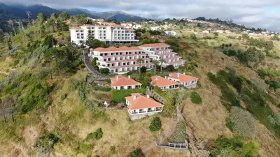 an aerial view of a building on a hill at Hotel Jardim Atlantico in Calheta