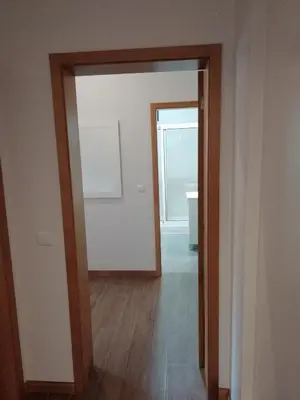 a hallway with an open door to a bathroom at Sweet Home for Holidays in Machico