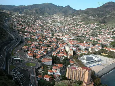 an aerial view of a city with buildings and roads at Sweet Home for Holidays in Machico