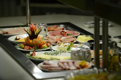 a buffet with many plates of food on a table at Hotel Do Campo in Ribeira Brava
