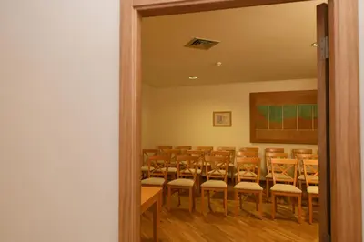 a room with a bunch of chairs in it at Hotel Do Campo in Ribeira Brava