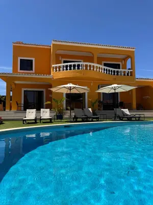 a living room with yellow chairs and a couch at Casa Concha - Peaceful and Relaxing in Lagos