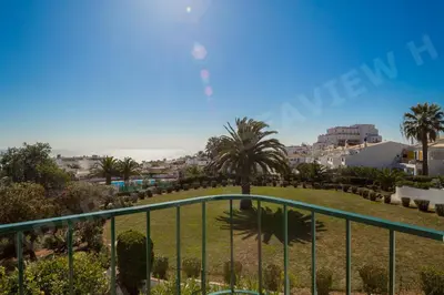 a view of the beach from the balcony of a resort at Seaview Apartment H in Luz