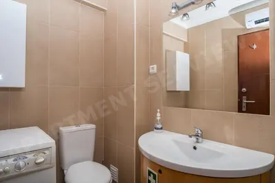 a bathroom with a sink and a toilet and a mirror at Seaview Apartment H in Luz