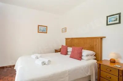 a bedroom with a bed with towels on it at Seaview Apartment H in Luz