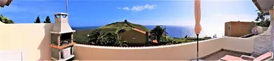 a view of a house with an island in the ocean at Beachfront House Atalaia in Caniço