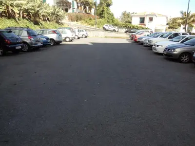 a bunch of cars parked in a parking lot at Apartamentos América - Blue Sea in Funchal