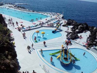 a group of people at a water park at Apartamentos América - Blue Sea in Funchal