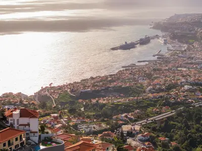 two images of a bathroom with a shower and a toilet at Funchal High View in Funchal