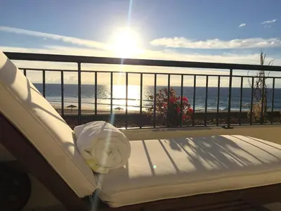 a bed on a balcony with a view of the ocean at Paradise Beach in Porto Santo
