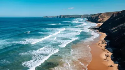 an aerial view of the ocean and a beach at Barranco da Fonte in Chabouco