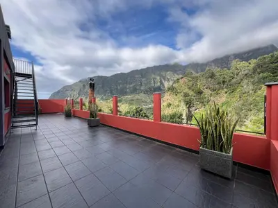 a balcony of a building with a view of a mountain at Casa Saramago by AnaLodges in São Vicente