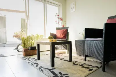 a living room with a table and two chairs at The House in Funchal