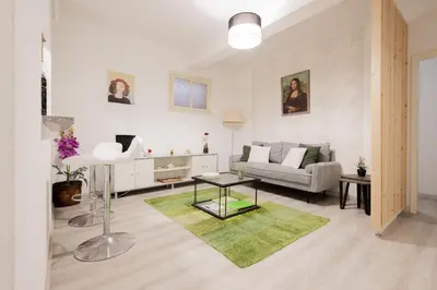 a living room with a couch and a table at The House in Funchal