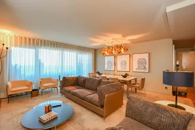 a living room with a couch and a dining room at Apartamento Astrolab in Funchal