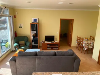 a living room with a couch and a table at Atlantic Rose in Calheta