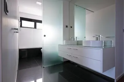 a white bathroom with two sinks and a mirror at Spacious luxury holiday apartment with a great view, Funchal, free wifi and parking in Funchal
