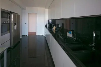 a kitchen with a sink and a counter top at Spacious luxury holiday apartment with a great view, Funchal, free wifi and parking in Funchal