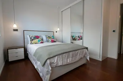 a bedroom with a large bed with pillows at Spacious luxury holiday apartment with a great view, Funchal, free wifi and parking in Funchal