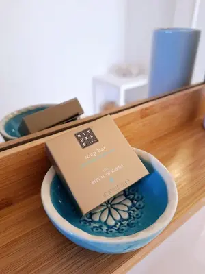 a box sitting on top of a bowl on a table at Romantik Villa in Salema
