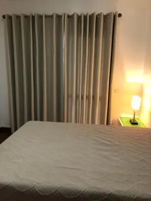 a bedroom with a bed and a window with curtains at Em casa longe de casa, tão bom! in Gaula