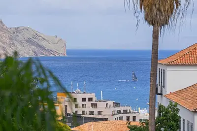 a view of the ocean with a boat in the water at Jasmineiro II by An Island Apart in Funchal
