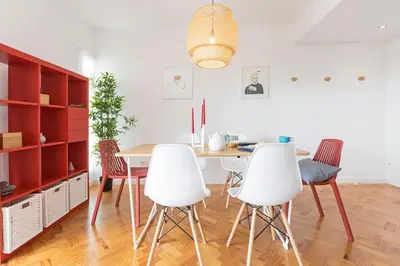 a dining room with a table and four chairs at Pina I by An Island Apart in Funchal