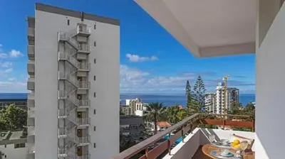 a balcony with a view of the ocean at Casa Branca by Homie in Funchal