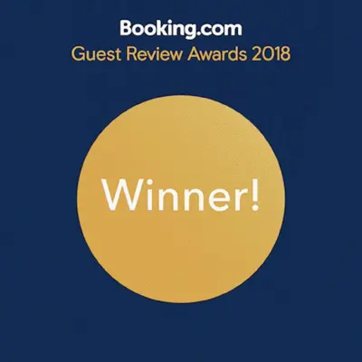 a yellow circle with the text guest review awards at Casa Branca by Homie in Funchal