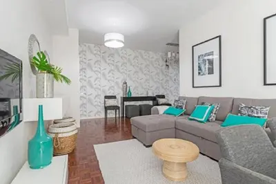 a living room with a couch and a table at Casa Branca by Homie in Funchal