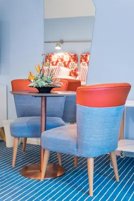 a room with two chairs and a table with a couch at Pestana Casino Studios in Funchal