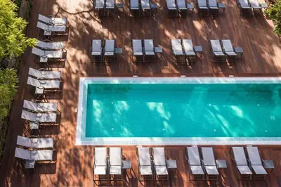 an overhead view of a swimming pool and chairs at Pestana Casino Studios in Funchal