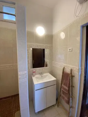 a bathroom with a sink and a mirror at Casa Alfarroba in Barão de São Miguel