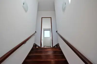 a stairway leading to a mirror in a building at Lazareto Apartment by Holiday Rental Madeira in Funchal