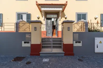 a front door of a building with stairs at Lazareto Apartment by Holiday Rental Madeira in Funchal