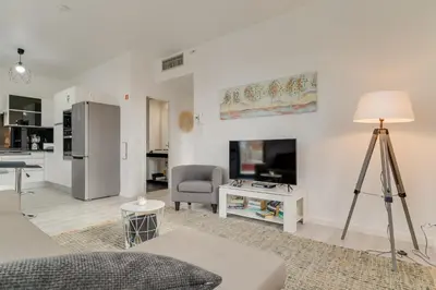 a living room with a couch and a table at Lazareto Apartment by Holiday Rental Madeira in Funchal