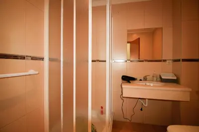a bathroom with a sink and a shower at Paradise Ocean View by AnaLodges in Porto Moniz