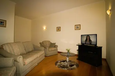 a living room with a couch and a tv at Paradise Ocean View by AnaLodges in Porto Moniz