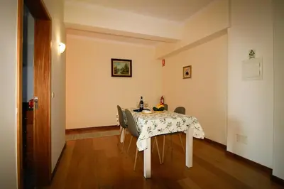 a dining room with a table and chairs in a room at Paradise Ocean View by AnaLodges in Porto Moniz