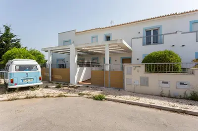 a blue van parked in front of a house at Your Villa Algarve Private pool 5 min walk to beach in Burgau