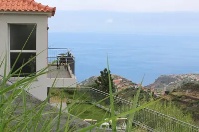 a building with a view of the mountains at Hills and Atlantic Ocean retreat - Conceição House in Calheta