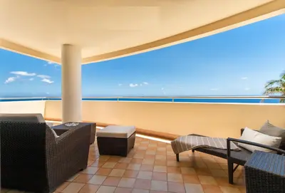 a balcony with a view of the ocean at OurMadeira - 6001 in Funchal