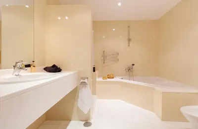 a large kitchen with white cabinets and a sink at OurMadeira - 6001 in Funchal