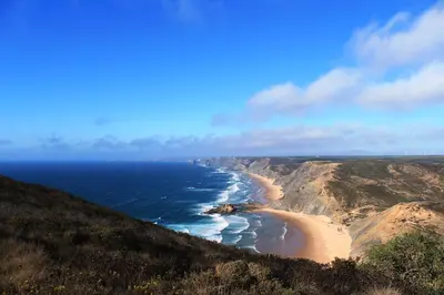 an aerial view of a beach on a cliff at Trivial Pisão - Casa de Férias, para a sua Família in Raposeira